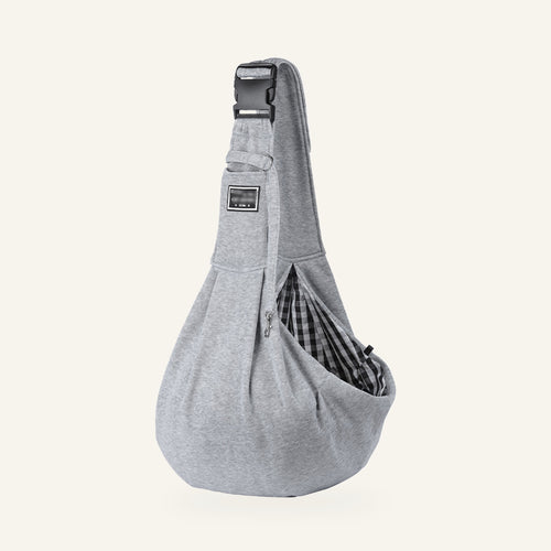 Gray Dog Sling with checked lining on an off-white background.
